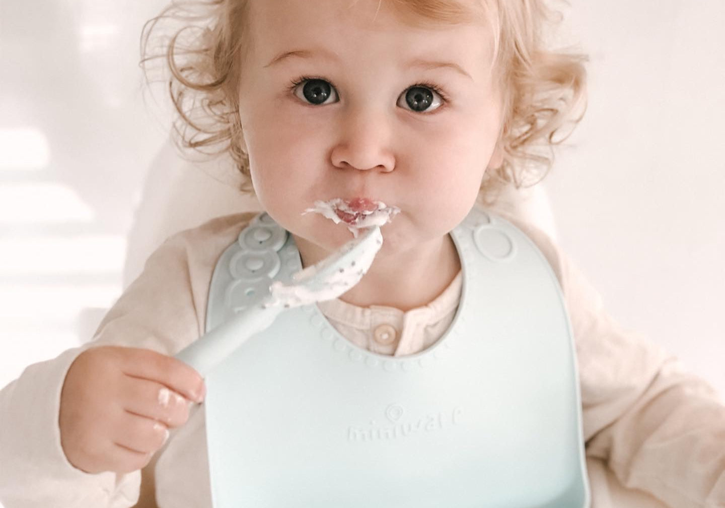 Miniware’s Roll & Lock silicone Bib Takes (Some) of the Mess Out of Self-Feeding Training