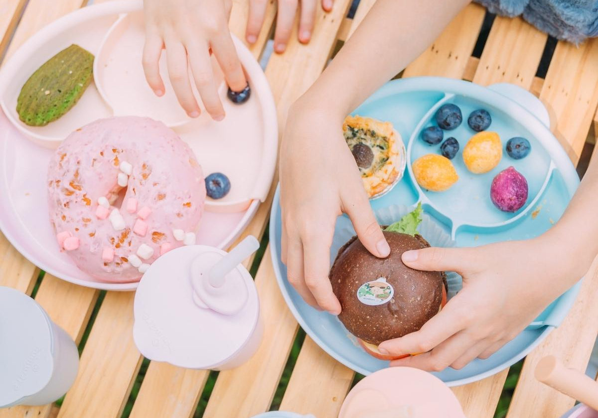 Picnic table with dessert snacks plated on Miniware Healthy Meal Set in Cotton Candy and Healthy Meal Set in Aqua